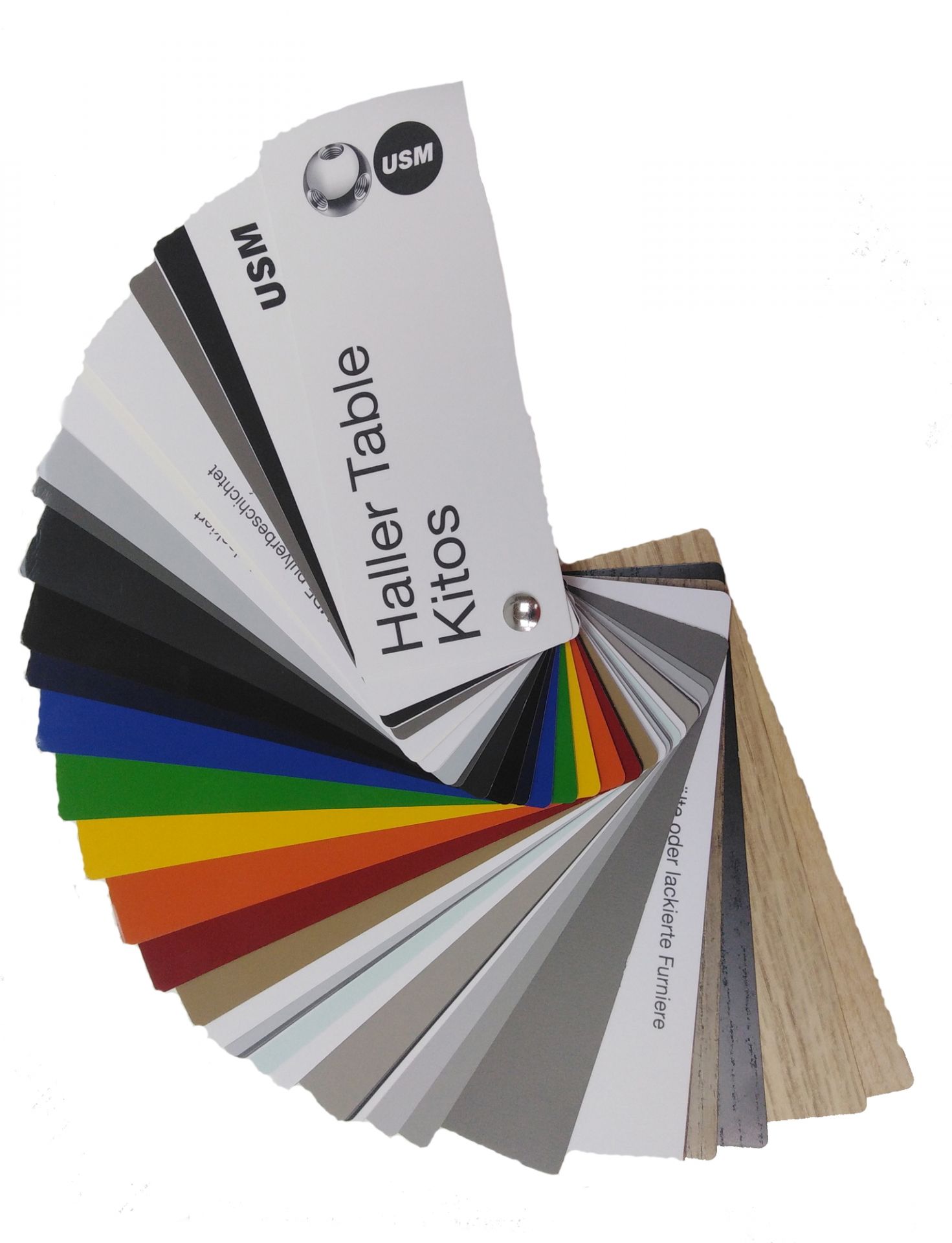 Farbmuster für USM Haller Tische: Farbpalette mit verschiedenen Farben und Materialien für Tischplatten.
